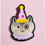 Cute cartoon cat in a party hat, perfect for stylish women’s clothes and polished prints