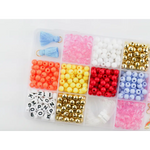Colorful beads in compartments for the Color my World Bracelet Craft Kit for stretchy bracelets