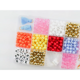 Colorful beads in compartments for the Color my World Bracelet Craft Kit for stretchy bracelets