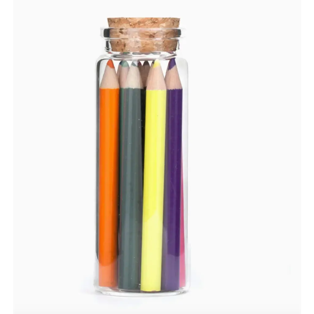 Colorful colored pencils in a glass jar perfect for stylish womens clothes and art projects