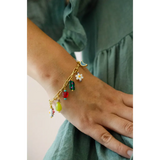 Colorful flower charm bracelet with whimsical pendants