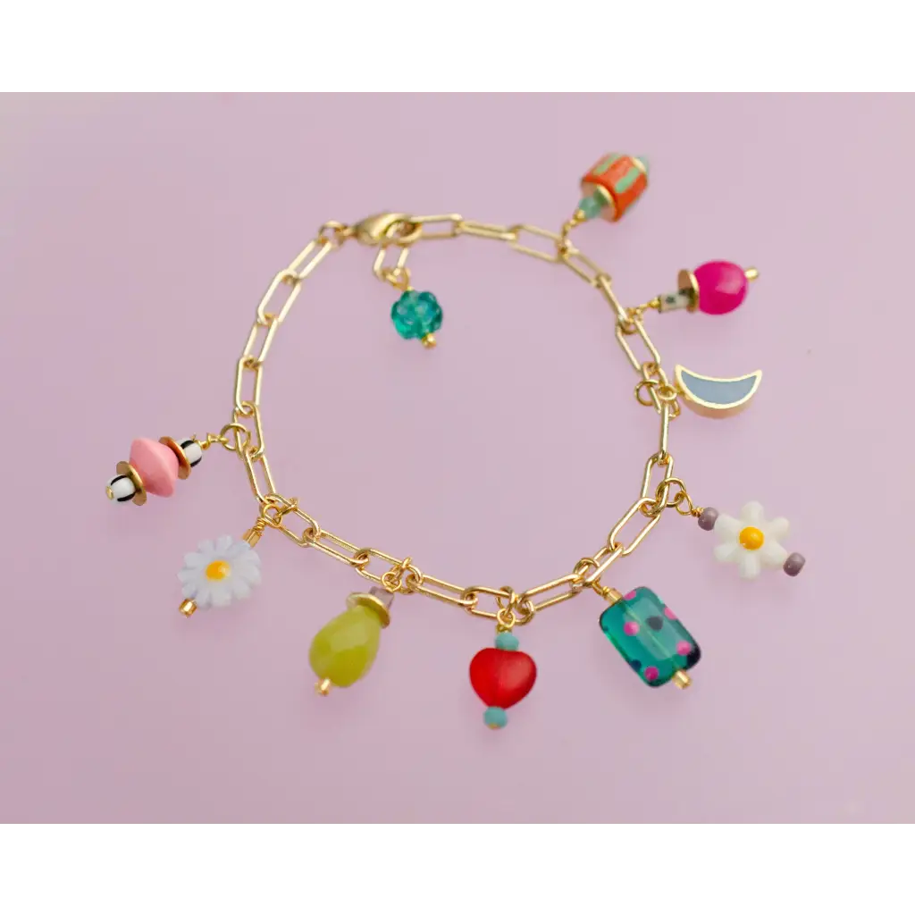 Gold-toned charm bracelet with colorful flower, fruit, moon charms