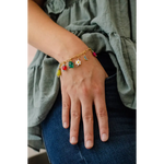 Colorful flower charm bracelet with gold-toned dangling charms