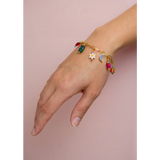 Gold-toned charm bracelet with colorful enamel daisy, moon, gift charms
