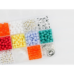 Colorful craft beads in a storage kit for making Cowboy Romance stretchy bracelets