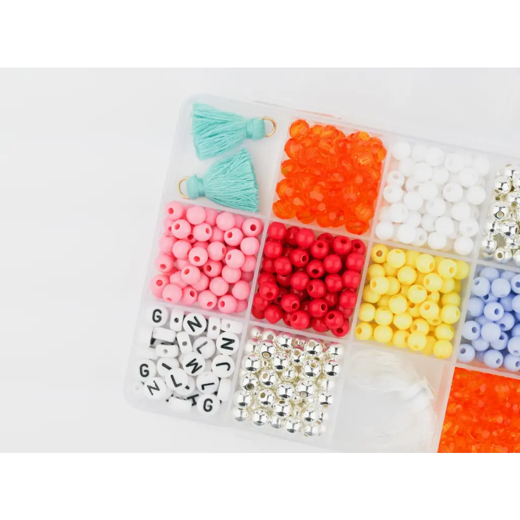 Plastic organizer box with colorful beads and letter cubes for stretchy bracelets craft kit