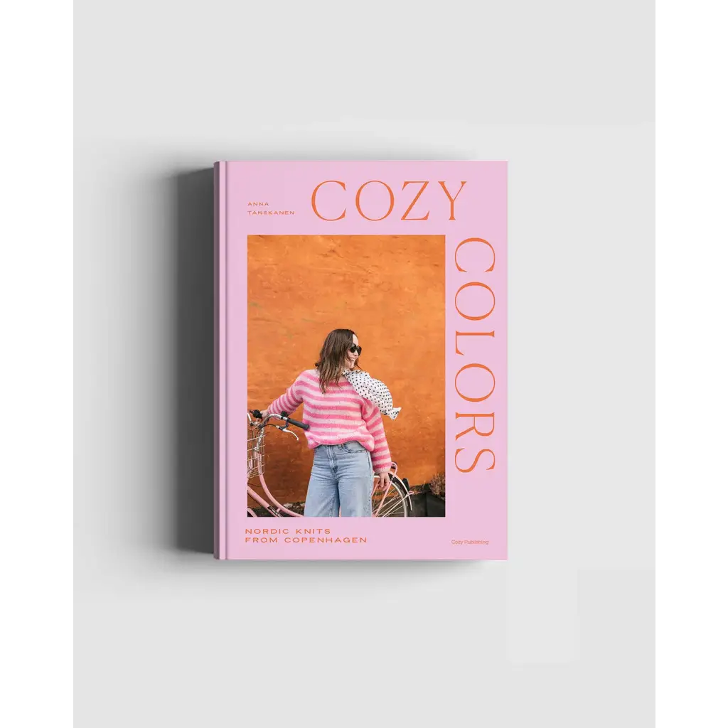Pink Cozy Colors book with Nordic knits woman in striped sweater