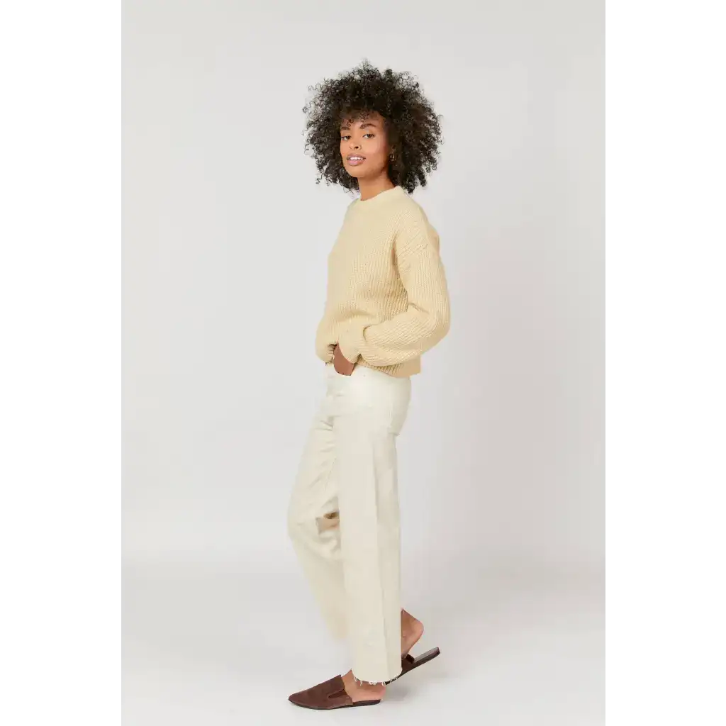 Cream-colored cropped sweater with high rise ecru jeans, stylish womens clothes