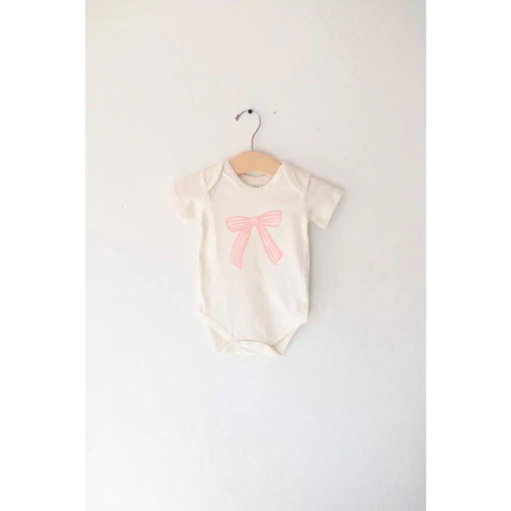 Baby Onesie with pink bow made from organic cotton featuring polished prints, Cutesy Bow