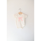 Baby Onesie with pink bow made from organic cotton featuring polished prints, Cutesy Bow