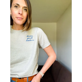 Woman wearing a damn good Mother Sweater Tee, perfect for a good mother vibe