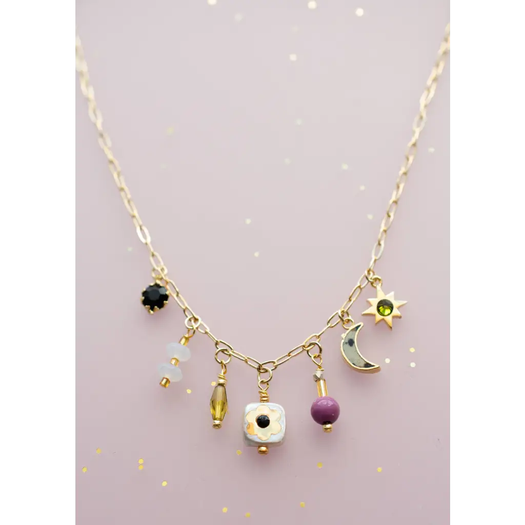 Dainty flower beaded charm necklace in gold with celestial motifs