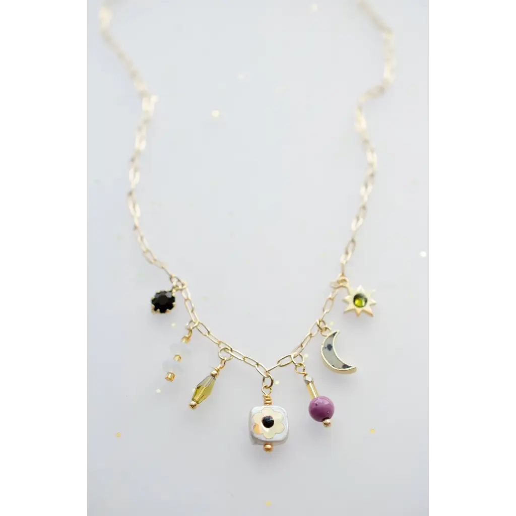 Dainty flower beaded charm necklace with gold chain, black gem, moon, star