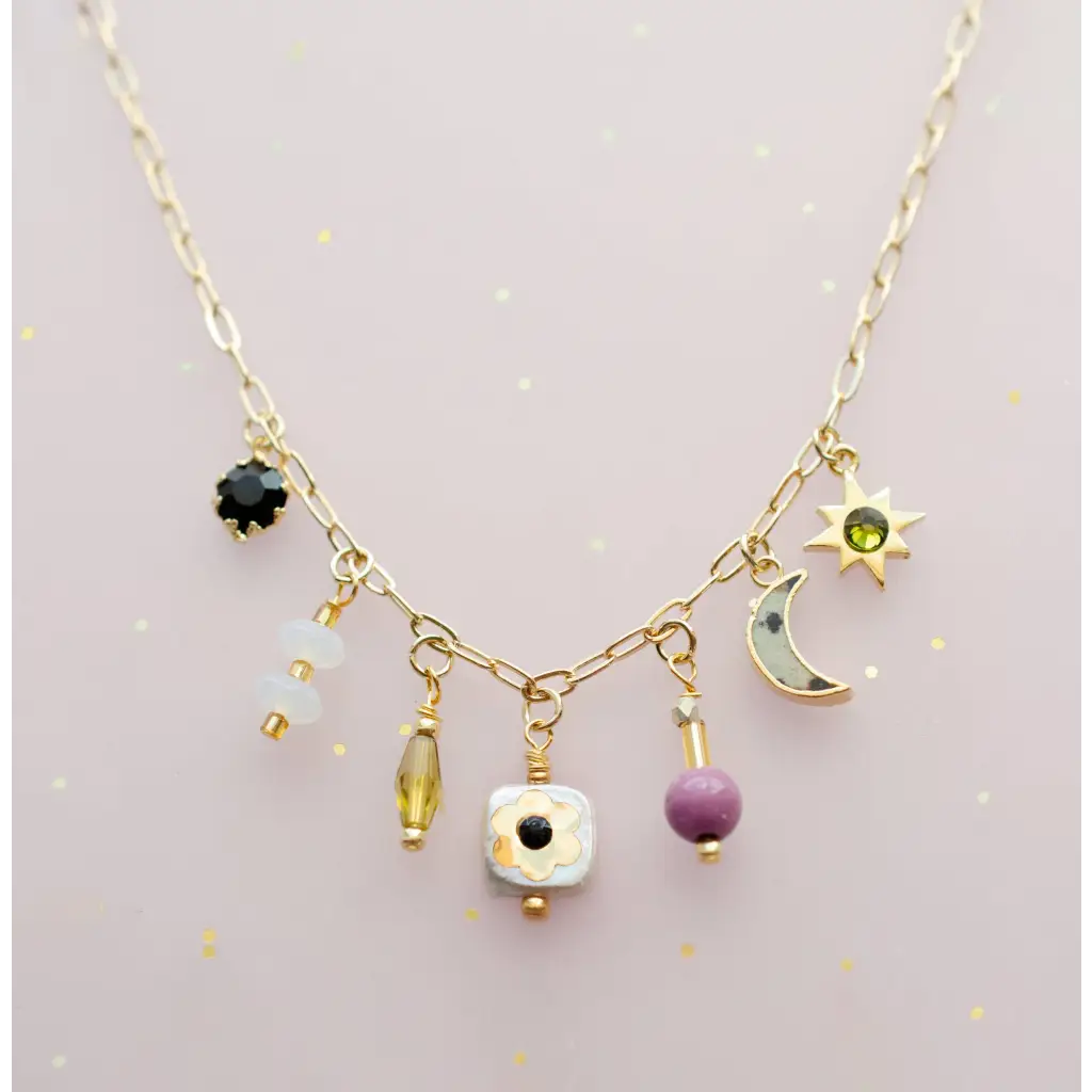 Dainty gold flower beaded charm necklace with celestial gems