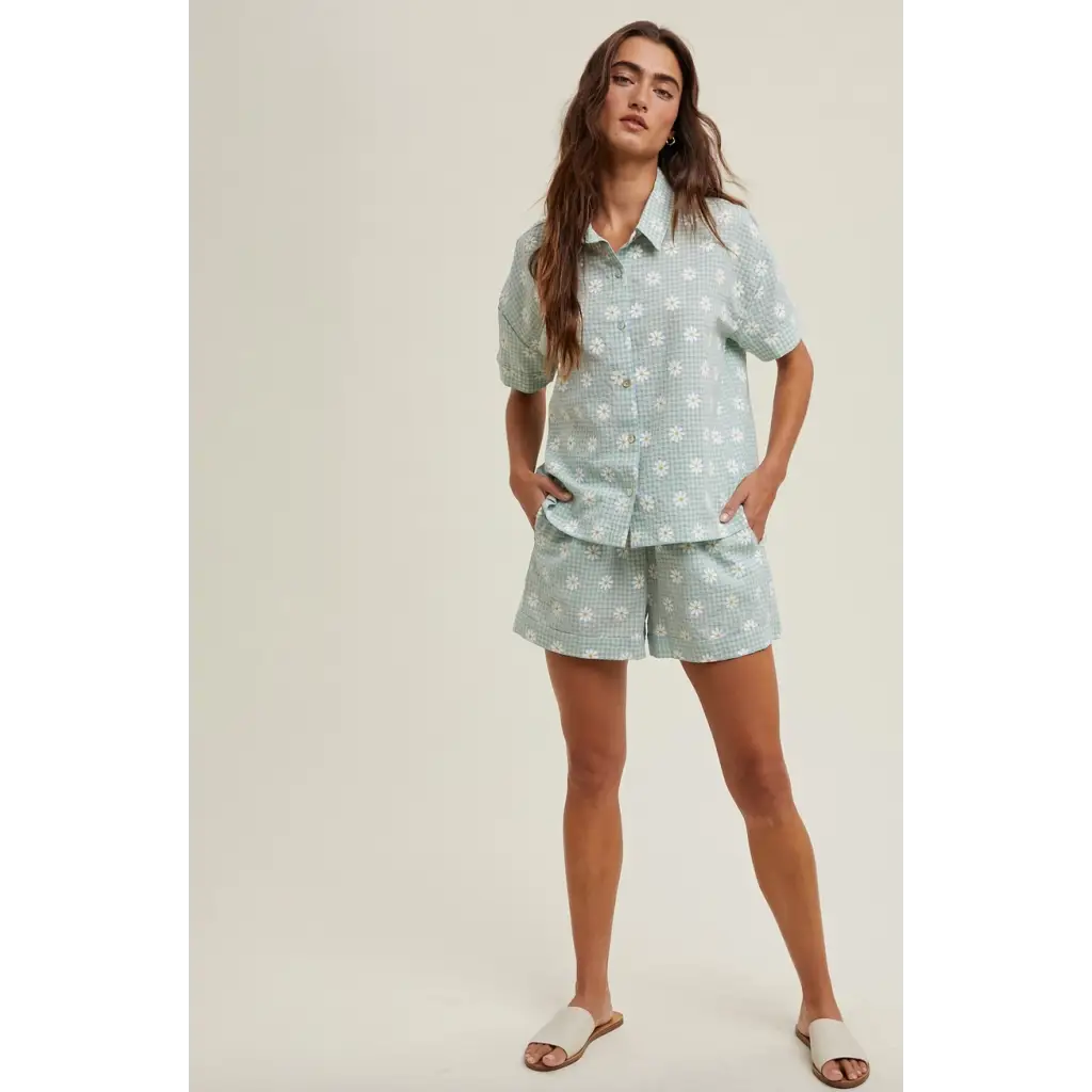 Woman wearing Daisy Days floral plaid shirt and shorts set in floral pajama style