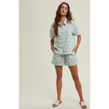 Woman wearing Daisy Days floral plaid shirt and shorts set in floral pajama style