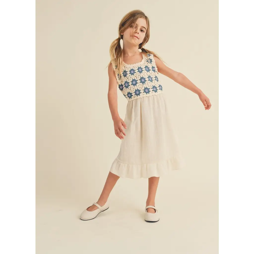 Girl wearing Daisy Dreams midi dress with crochet top and Mary Jane shoes
