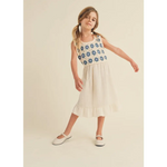 Girl wearing Daisy Dreams midi dress with crochet top and Mary Jane shoes