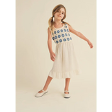 Girl wearing Daisy Dreams midi dress with crochet top and Mary Jane shoes