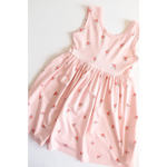 Pink sleeveless Daisy Twirl Dress featuring a cute floral print for playful adventures