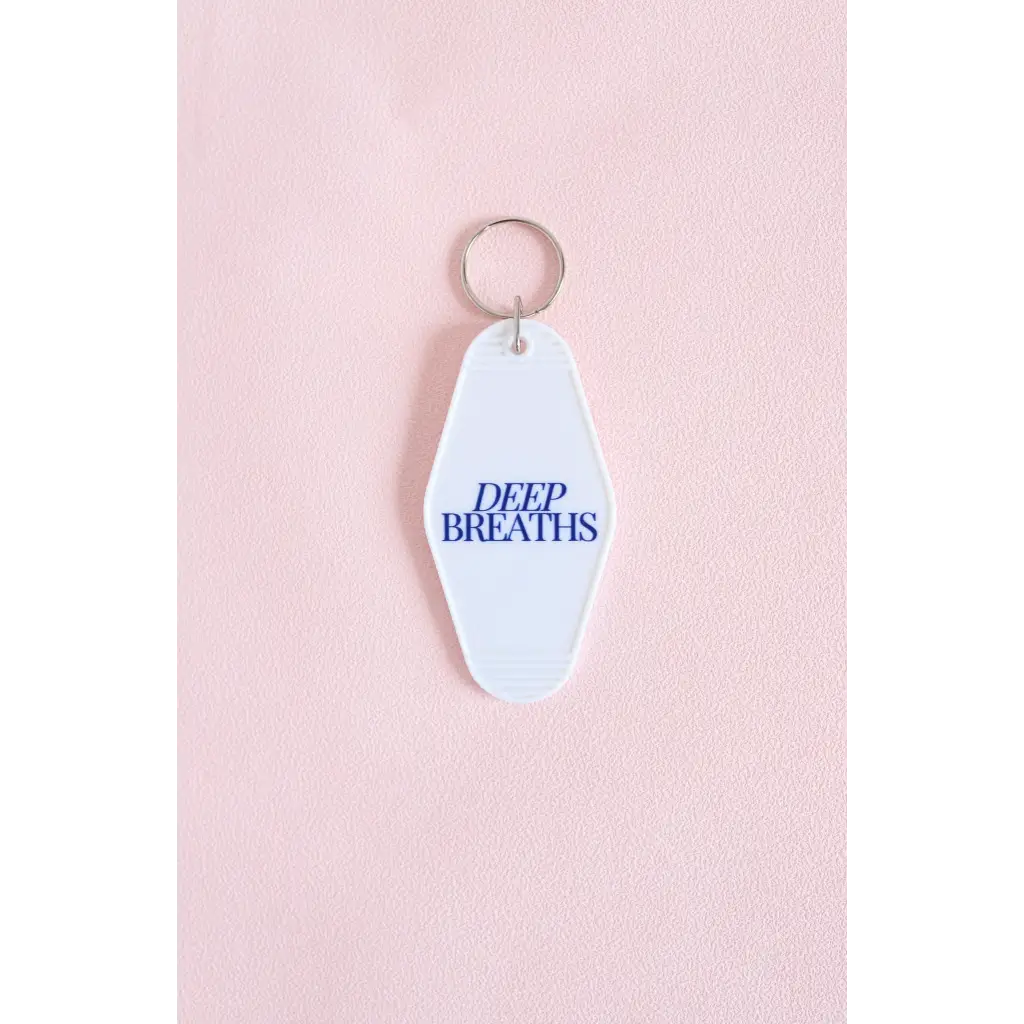 White vintage hotel keychain with Deep Breaths text in blue for calm moments