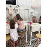 Kids having fun at the craft bar during a Design Your Own T-Shirt Party with a bar host