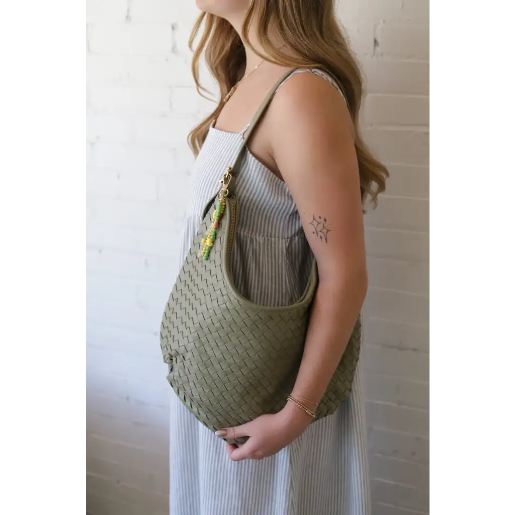 Diana Woven Bag XL in sage green vegan leather with two interior pockets and beaded charm