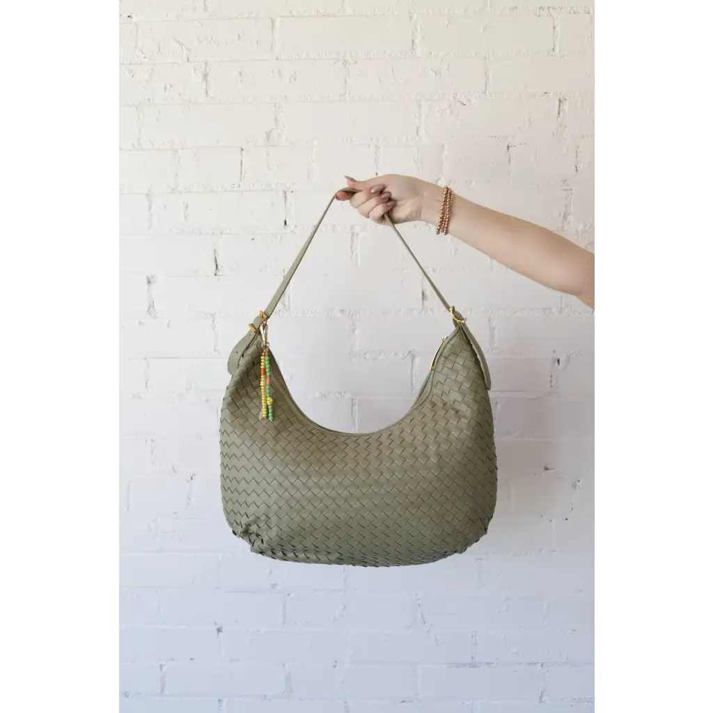 Olive green woven leather Diana Woven Bag XL with colorful beaded tassel and two interior pockets