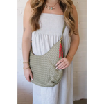 Pale green Diana Woven Bag XL in vegan leather with red tassel charm and two interior pockets