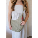 Pale green Diana Woven Bag XL in vegan leather with red tassel charm and two interior pockets