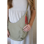 Light green Diana Woven Bag XL in vegan leather with two interior pockets and red beaded tassel