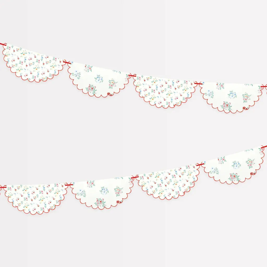 Ditsy posy paper garland with white scalloped banner, ditsy floral clusters, red edges
