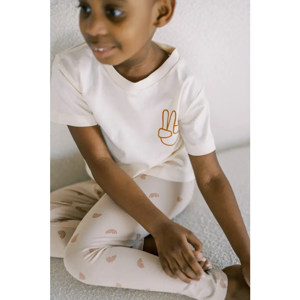 White t-shirt with peace sign, perfect with Ditsy Rainbow Leggings for kids