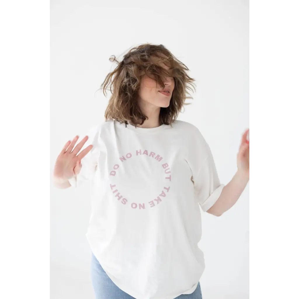 White graphic tee featuring a cozy relaxed fit and polished pink text design