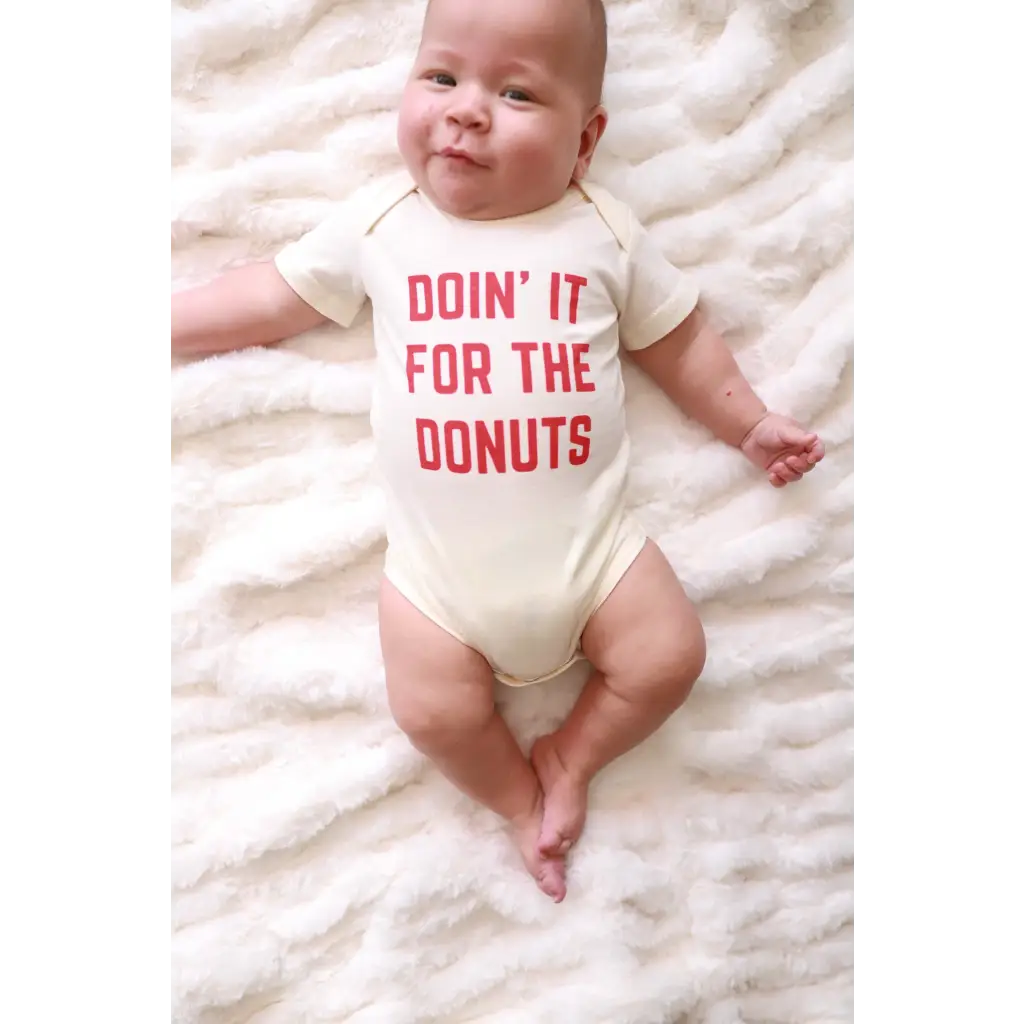 Playful Baby Onesie in organic cotton with red Doin It For The Donuts text