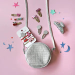 Silver quilted round crossbody bag with adjustable strap from Dolly Disco Cowgirl Boots, perfect for stylish womens clothes