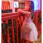 Young girl in pink tutu dress with colorful hair clips wearing Dolly Disco Cowgirl Boots