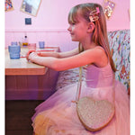 Young girl in pink ballet leotard with sparkly heart purse, showcasing Dolly Disco Cowgirl Boots