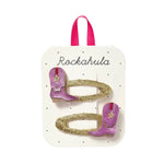 Sparkly gold hair clips with purple Cowgirl Boots decor on branded card for stylish womens clothes