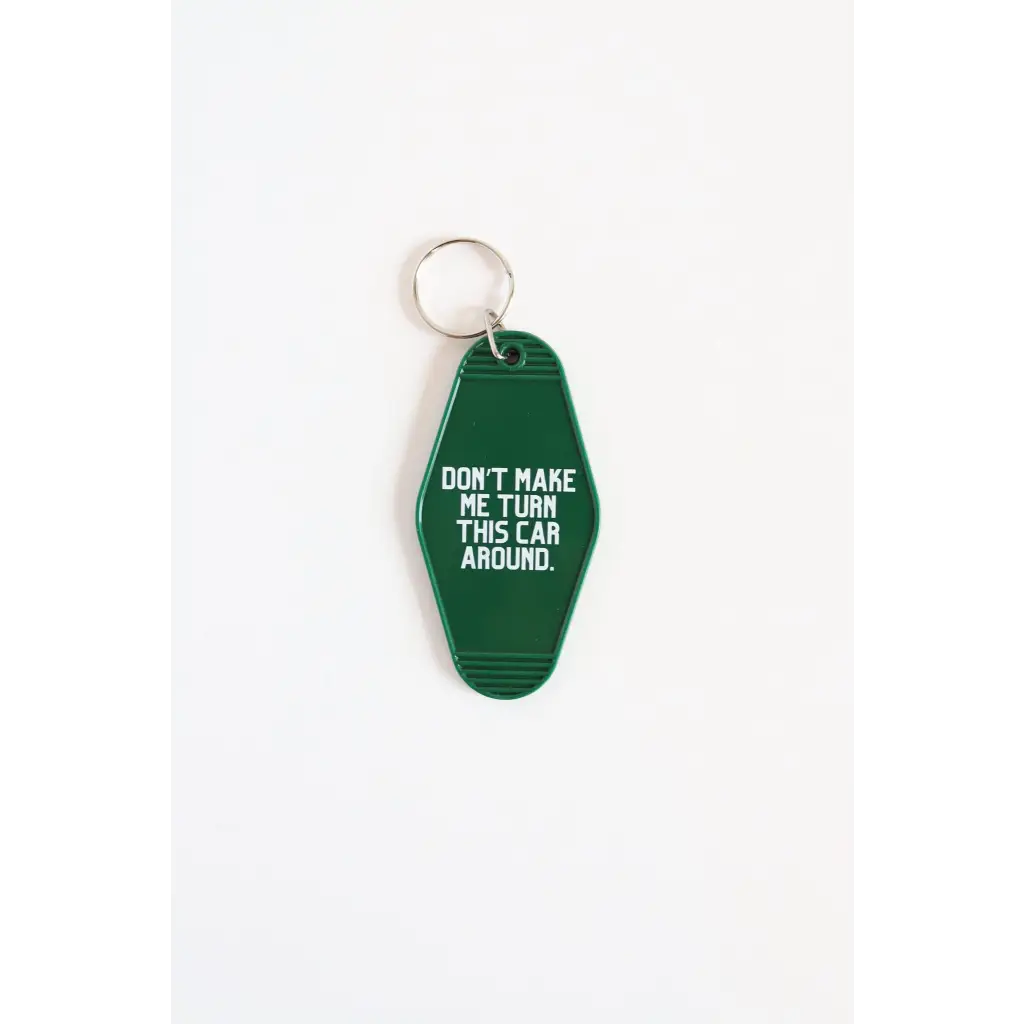 Green vintage hotel keychain with funny text Don’t Make Me Turn This Car Around