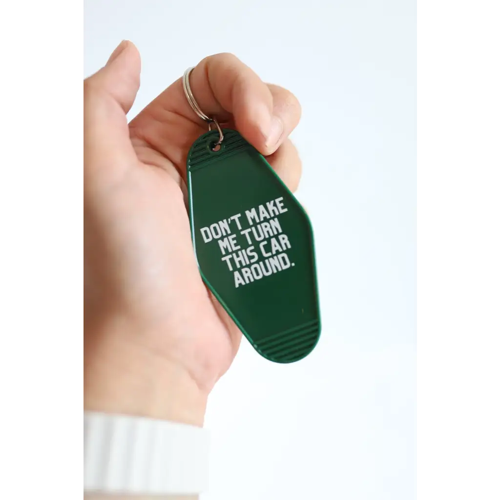 Green vintage hotel keychain tag with funny Don’t Make Me Turn This Car Around text