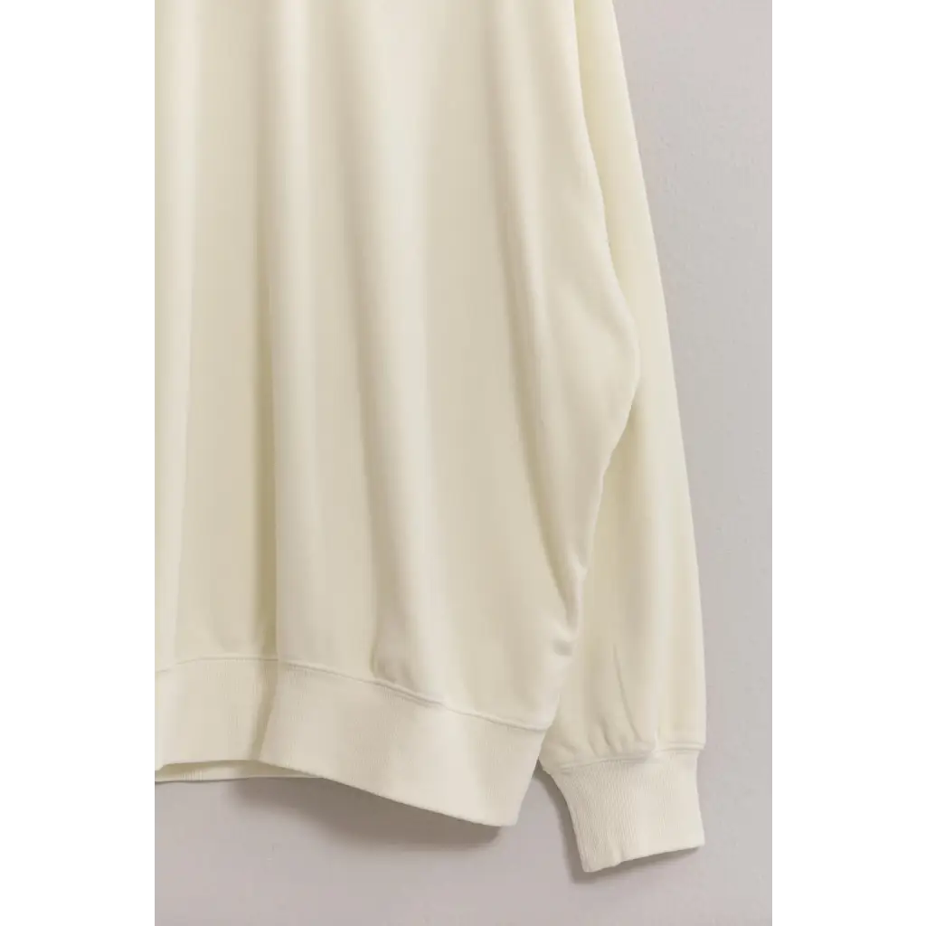 Cream-colored sweatshirt sleeve with ribbed cuff from Drew’s Crew Neck Drop Shoulders Sweatshirt