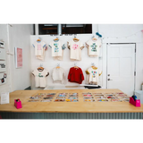 Clothing display at Edwardsville Craft Bar showcasing stylish outfits for shoppers