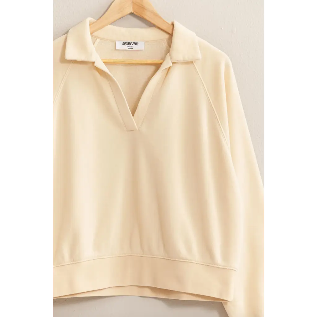 Cream-colored collared pullover sweatshirt for stylish moms, perfect for polished prints