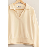 Cream-colored collared pullover sweatshirt for stylish moms, perfect for polished prints