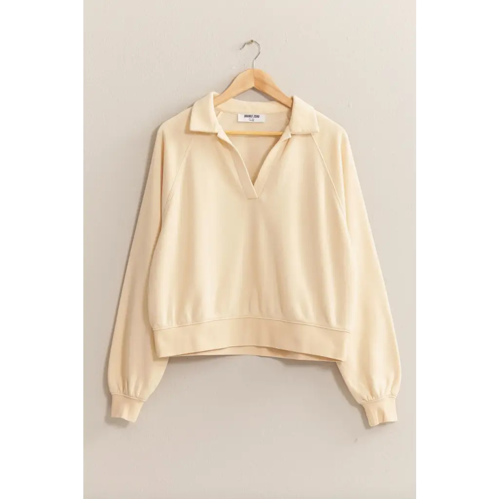 Cream collared pullover sweatshirt on hanger, perfect stylish womens clothes for moms