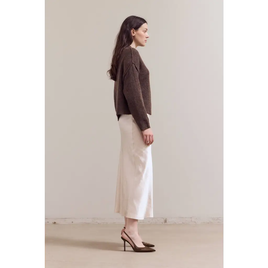 Stylish womens henley sweater with cream linen midi skirt and brown heels