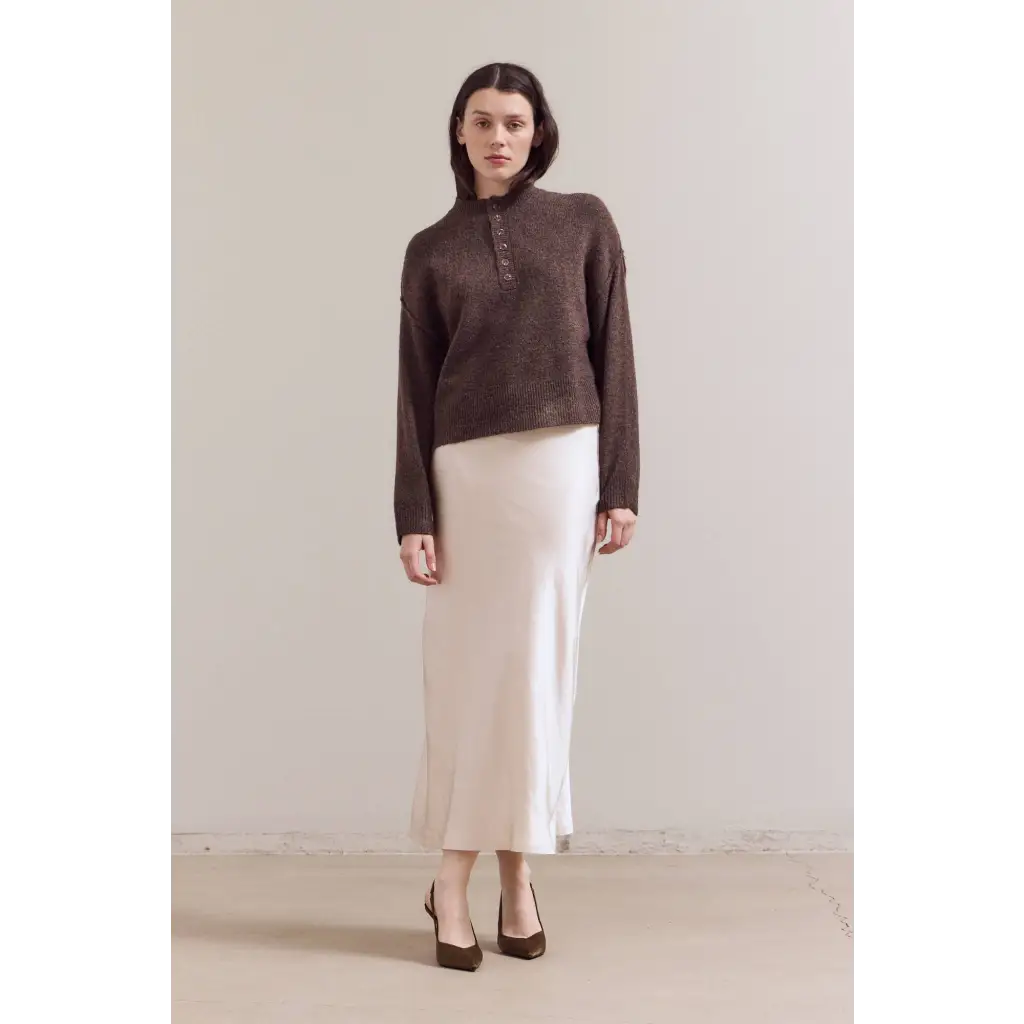 Ellia henley sweater with white skirt and black shoes