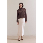 Ellia henley sweater with white skirt and black shoes
