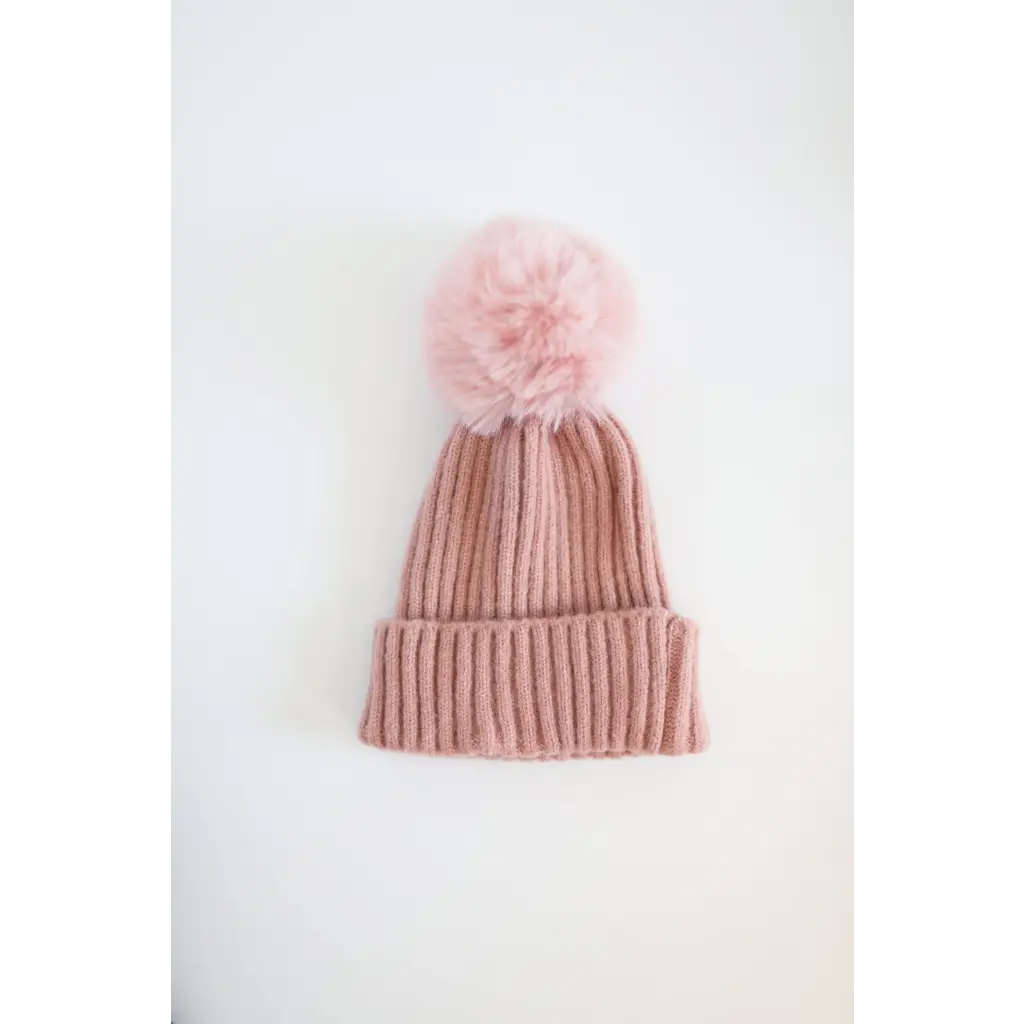 Cute Pink Knit Eloise Pom Pom Beanie for Kids, perfect for stylish moms’ winter looks